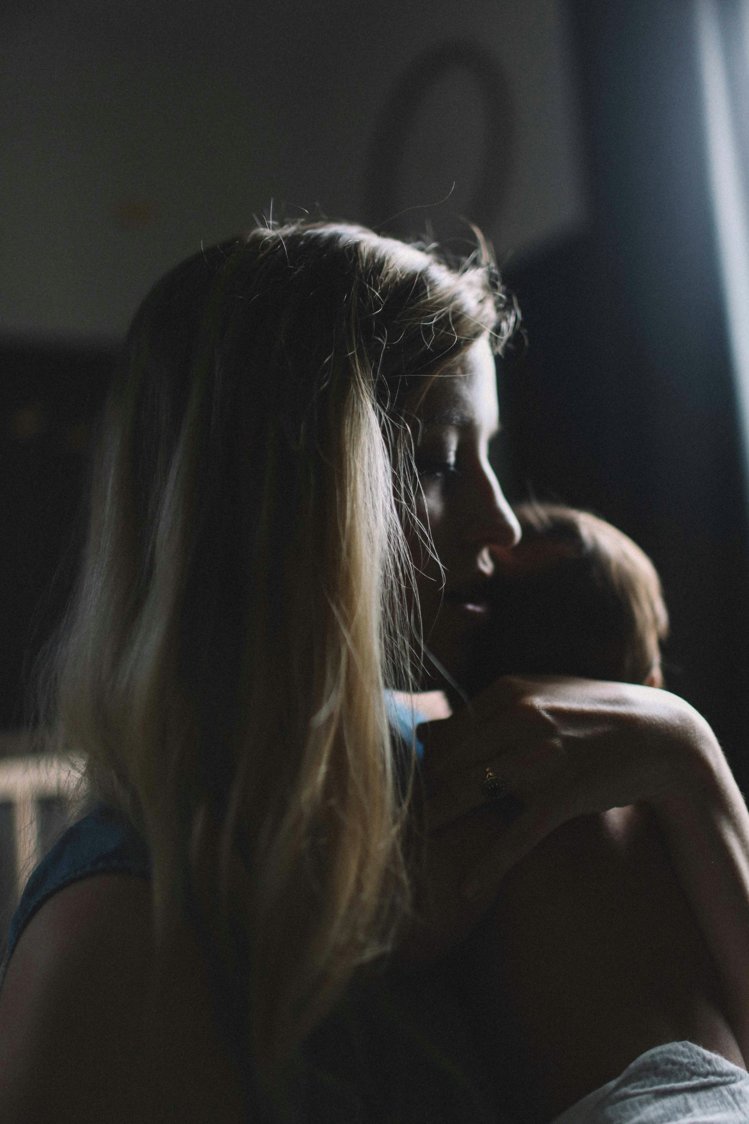 A photo of a woman holding a baby.